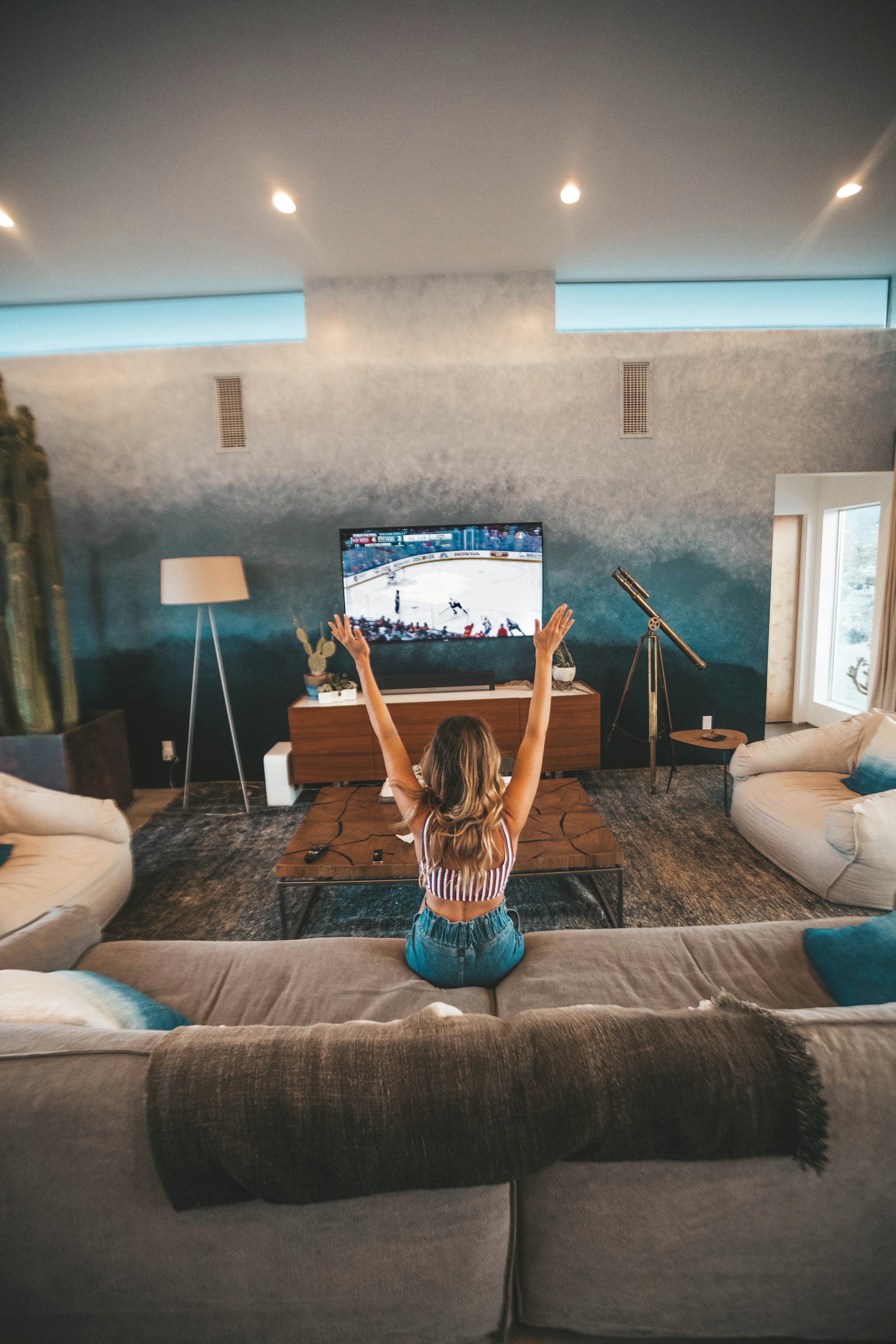 Couple testing IPTV streaming quality on television before committing to annual subscription