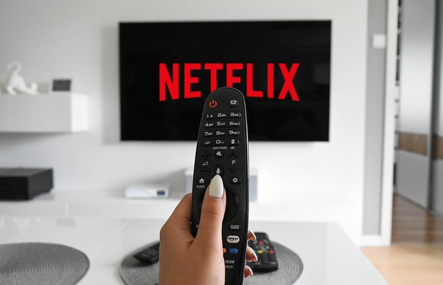 TV remote in hand — Gamma IPTV runs on Firestick, Smart TV, Android, iOS and MAG devices