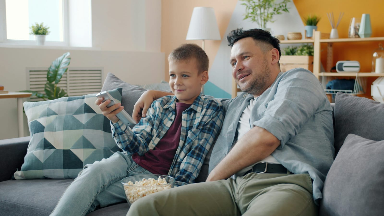 Family enjoying an evening streaming IPTV content on a large smart television